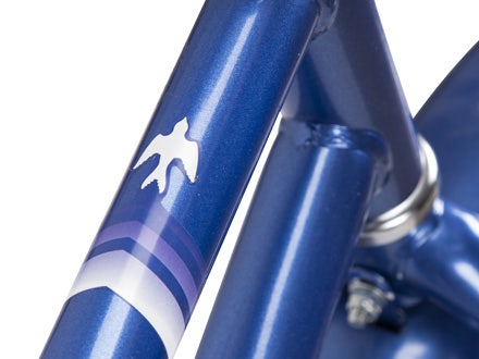 Close-up of the Huffy Good Vibrations 20” Girls Cruiser bike’s durable steel frame with bird-themed graphics. Close-up of the Huffy Good Vibrations 20” Girls Cruiser bike’s durable steel frame with bird-themed graphics.