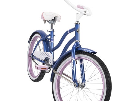 Angled view of the Huffy Good Vibrations cruiser bike showcasing its comfortable ergonomic grips and upright seating position. Angled view of the Huffy Good Vibrations cruiser bike showcasing its comfortable ergonomic grips and upright seating position.