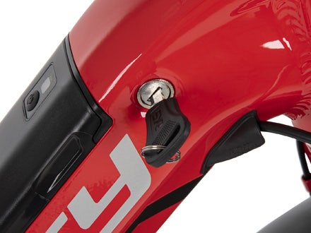 Close-up of the key ignition and locked battery on the Huffy Centuric electric bike, showcasing secure and easy-to-use functionality. Close-up of the key ignition and locked battery on the Huffy Centuric electric bike, showcasing secure and easy-to-use functionality.